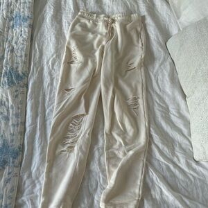 Alo ripped cream sweatpants